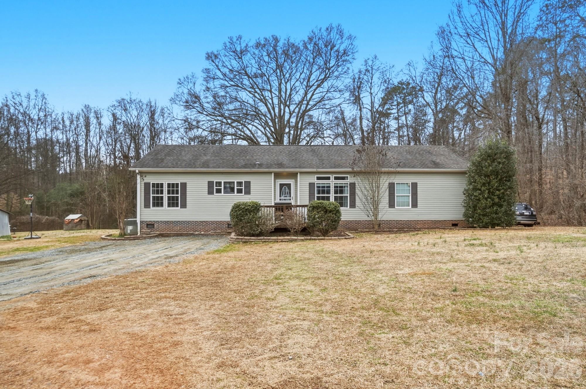 158 Cooks Lake Road Gastonia, NC 28056 - Photo 24 of 27 a view of a yard in front of a house with trees