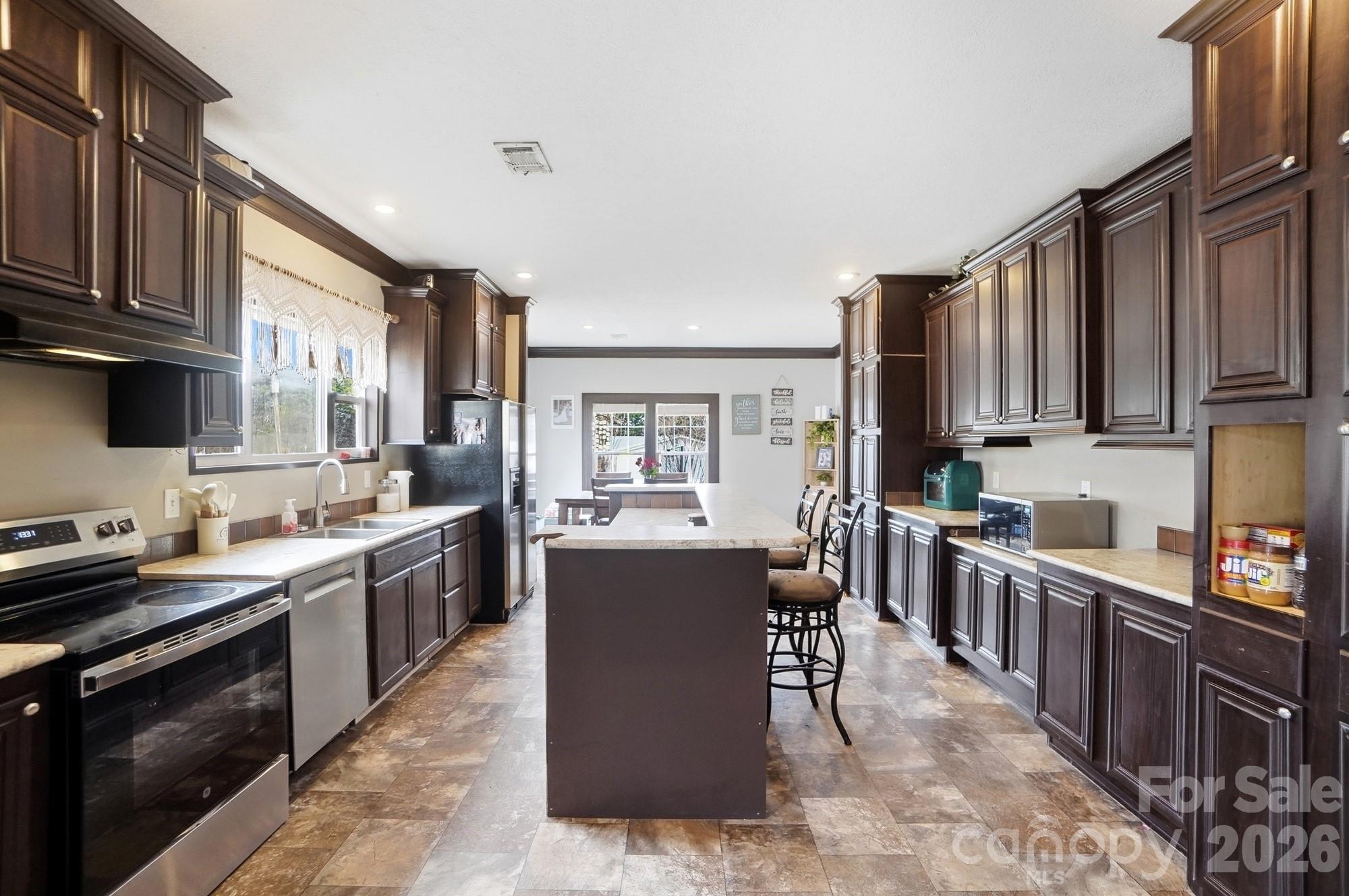 158 Cooks Lake Road Gastonia, NC 28056 - Photo 3 of 27 a kitchen with lots of counter top space