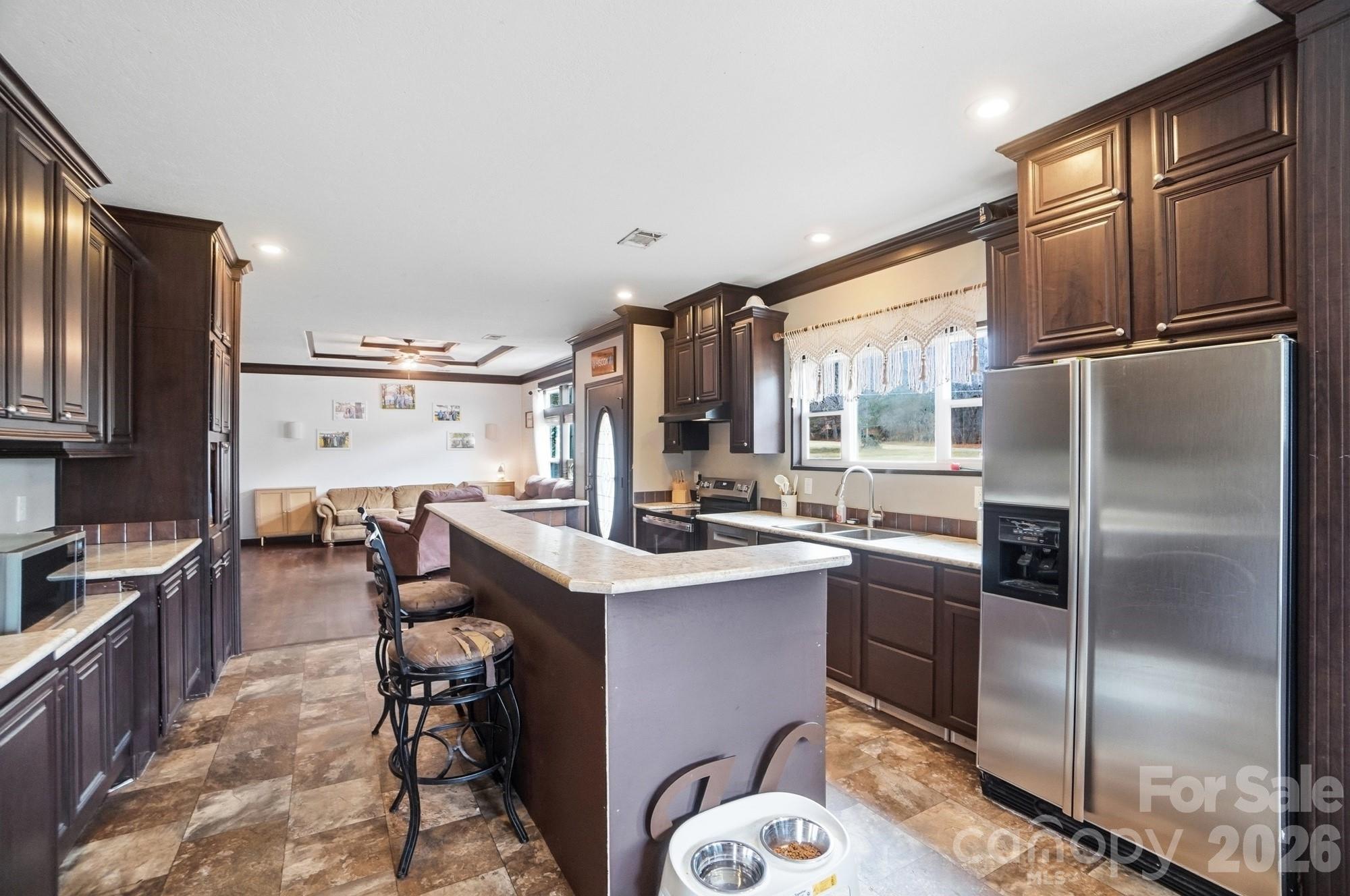 158 Cooks Lake Road Gastonia, NC 28056 - Photo 10 of 27 a kitchen with stainless steel appliances granite countertop a refrigerator a sink a stove and island