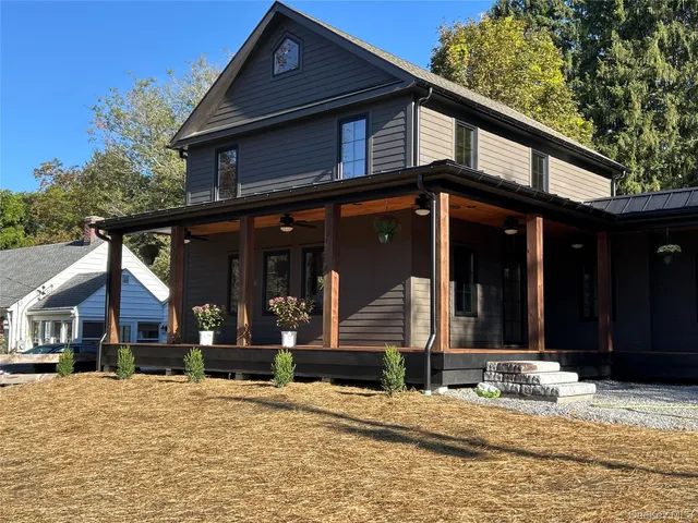 a front view of a house with a patio