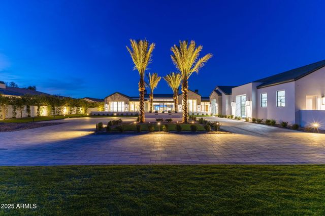 a view of an chairs in front of house