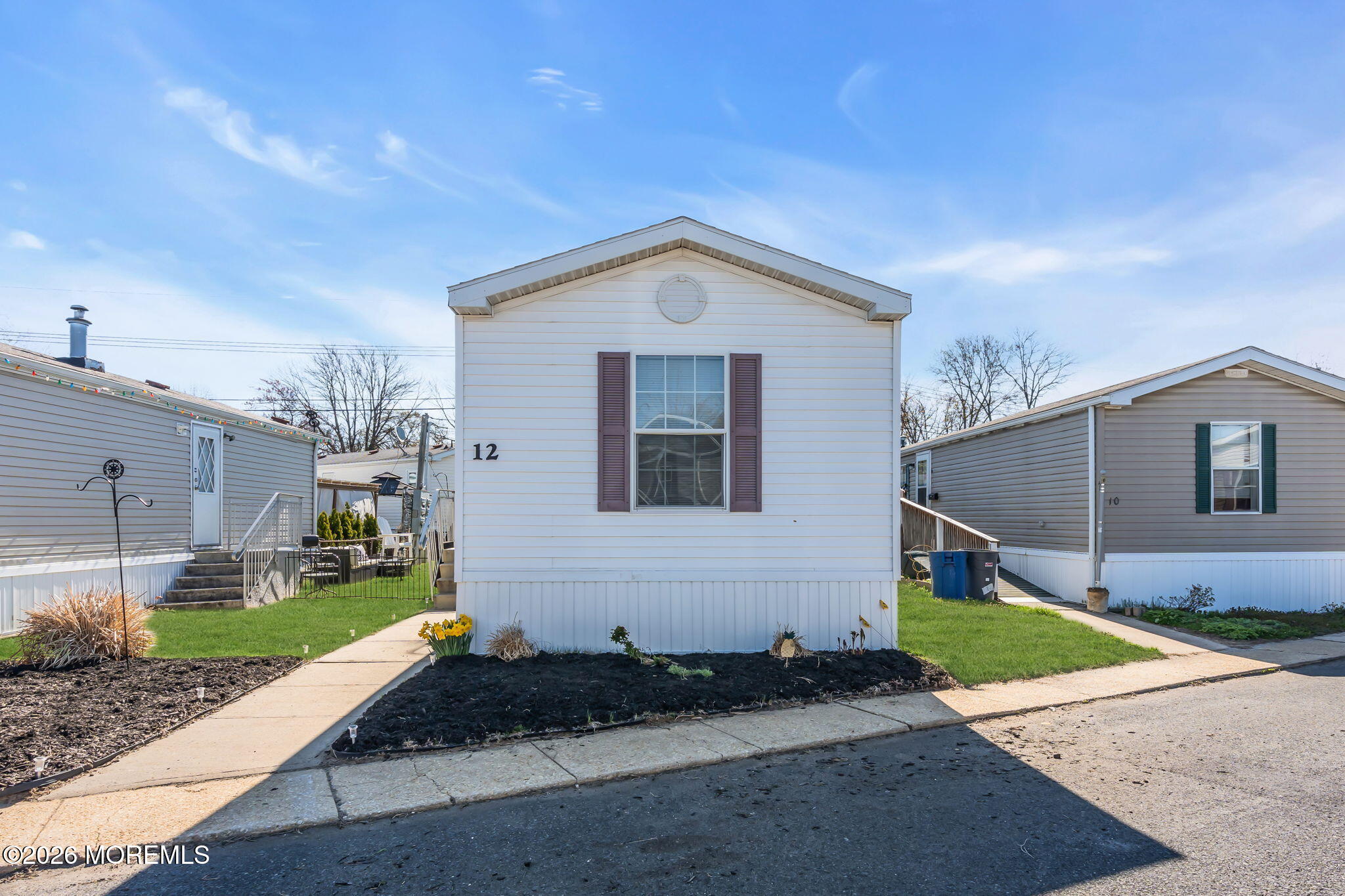 12 Locust Grove Hazlet, NJ 07730 - Photo 1 of 14 a view of a house with a yard