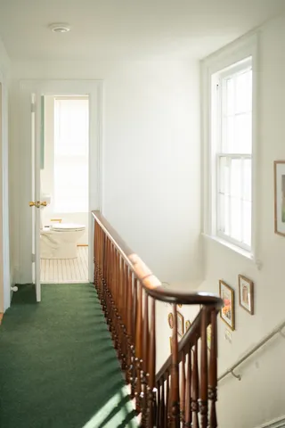 a view of an entryway with wooden floor