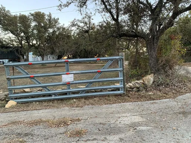 a kitchen with stainless steel appliances granite countertop a refrigerator and a stove