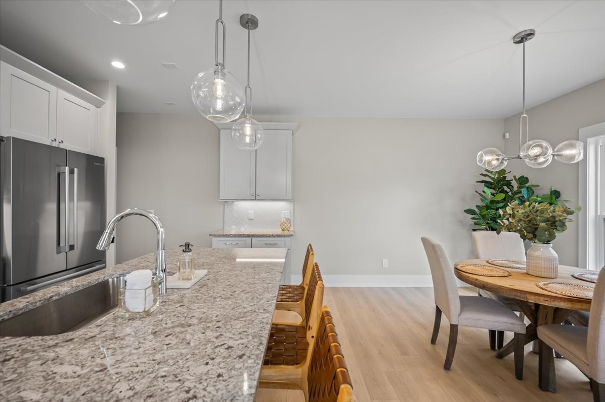 3045 A Hillside Road Nashville, TN 37207 - Photo 12 of 37 a kitchen with granite countertop a table and chairs