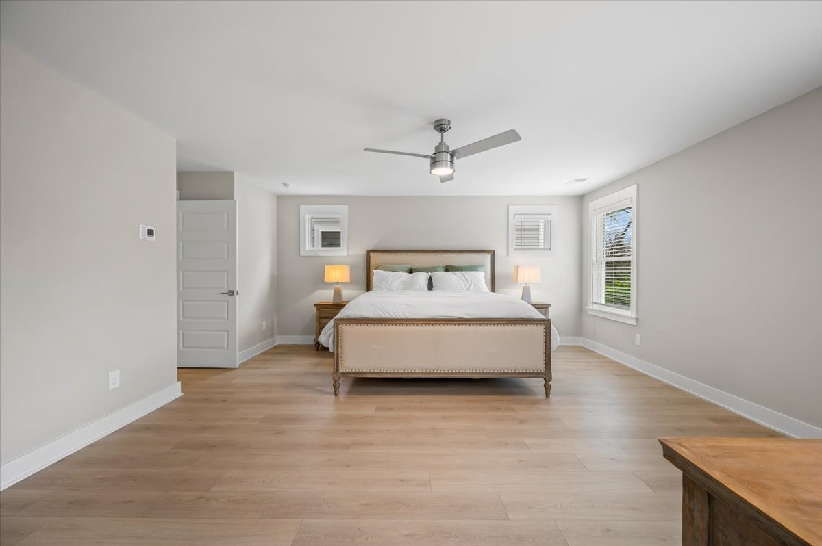 3045 A Hillside Road Nashville, TN 37207 - Photo 17 of 37 a spacious bedroom with a bed and a chandelier