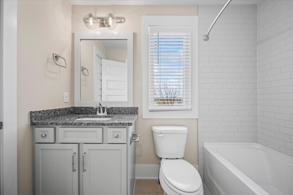 3045 A Hillside Road Nashville, TN 37207 - Photo 27 of 37 a bathroom with a granite countertop toilet a sink and bathtub