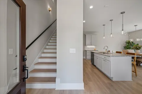 a kitchen with cabinets a sink and appliances