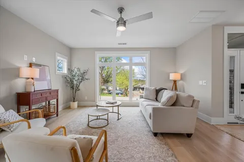 a kitchen with cabinets table and chairs