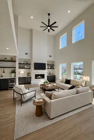 a living room with furniture wooden floor and a fireplace