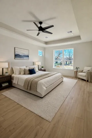 a bedroom with a large bed and a chandelier