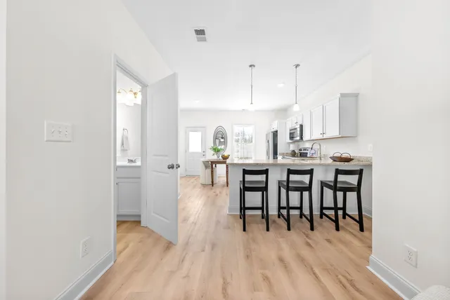 a view of a dining area with furniture and wooden floor