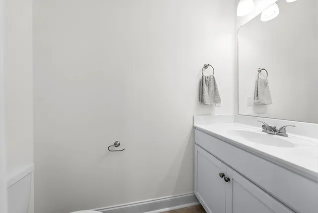 a bathroom with a sink and mirror