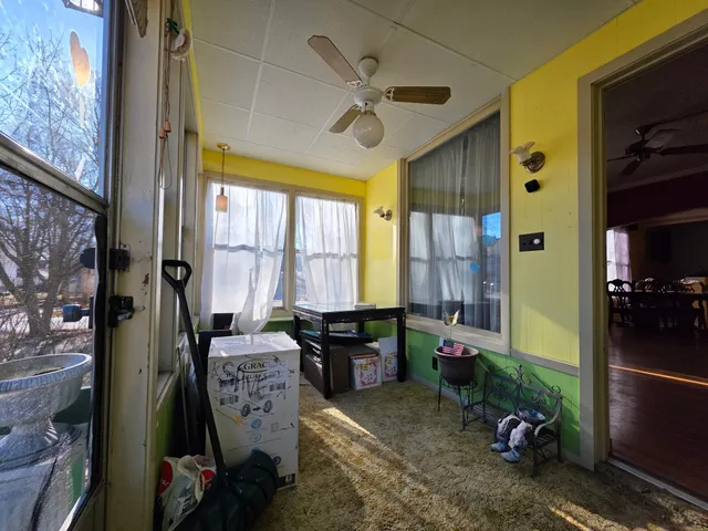 a view of a livingroom with furniture and a window