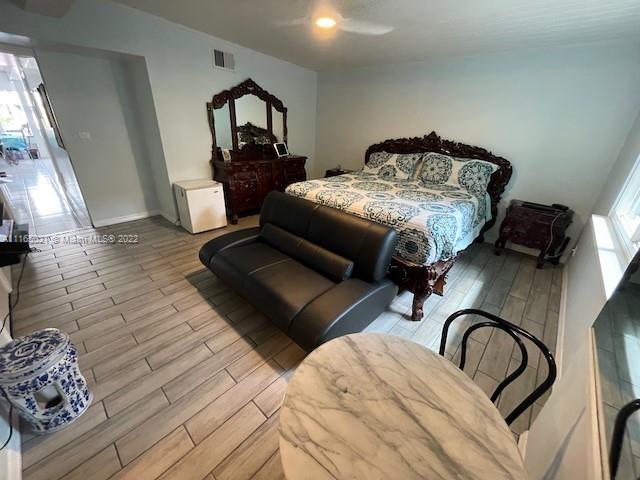 3 Sunset Lane Lauderdale-by-the-Sea, FL 33062 - Photo 13 of 36 a bedroom with furniture and a window