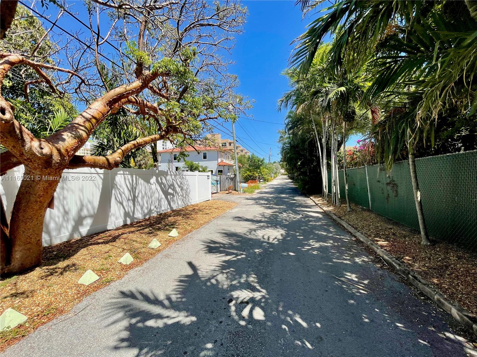 3 Sunset Lane Lauderdale-by-the-Sea, FL 33062 - Photo 23 of 36 a view of a yard with plants and trees