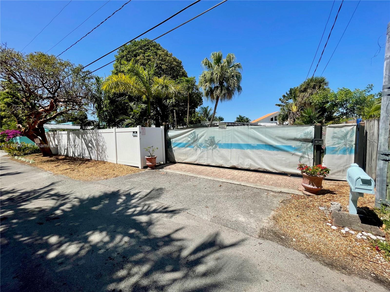 3 Sunset Lane Lauderdale-by-the-Sea, FL 33062 - Photo 24 of 36 a view of a backyard of the house