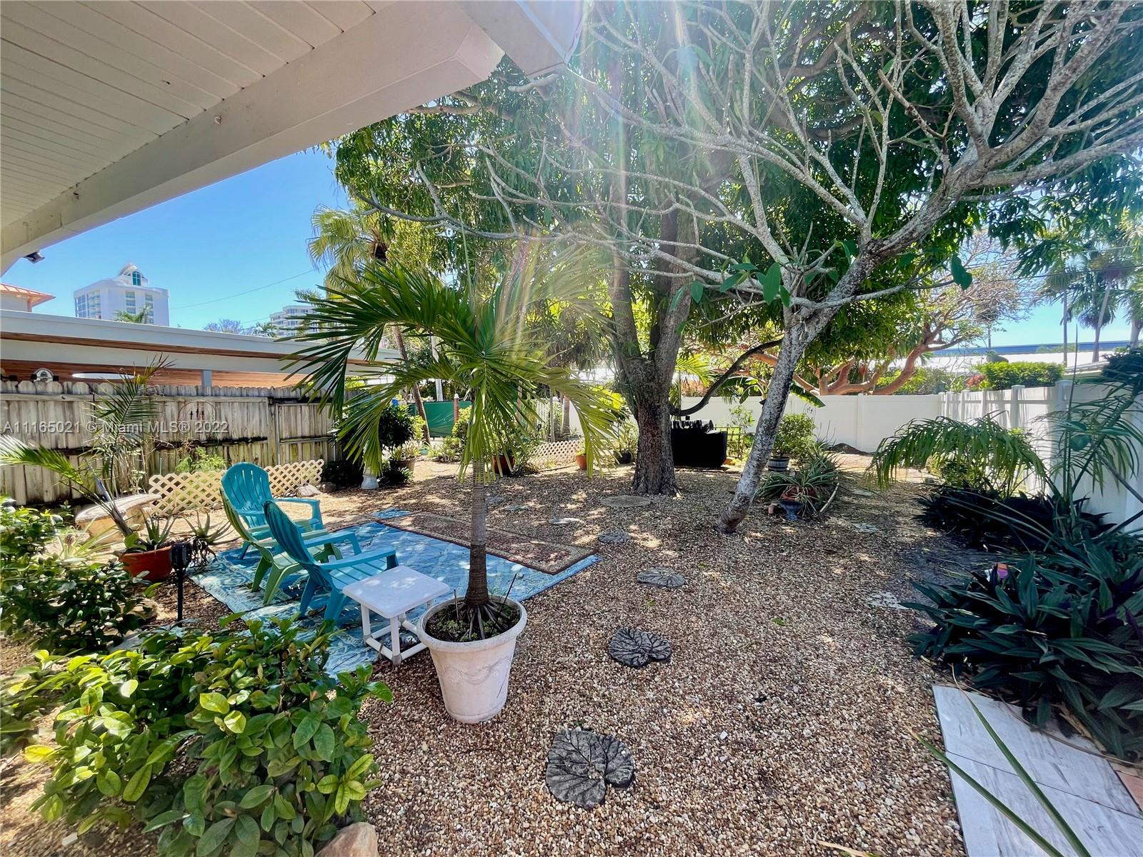 3 Sunset Lane Lauderdale-by-the-Sea, FL 33062 - Photo 28 of 36 a view of a backyard with sitting area