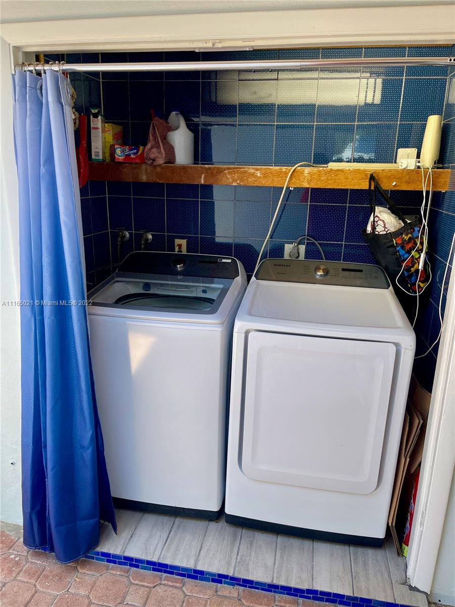 3 Sunset Lane Lauderdale-by-the-Sea, FL 33062 - Photo 33 of 36 a utility room with dryer and washer