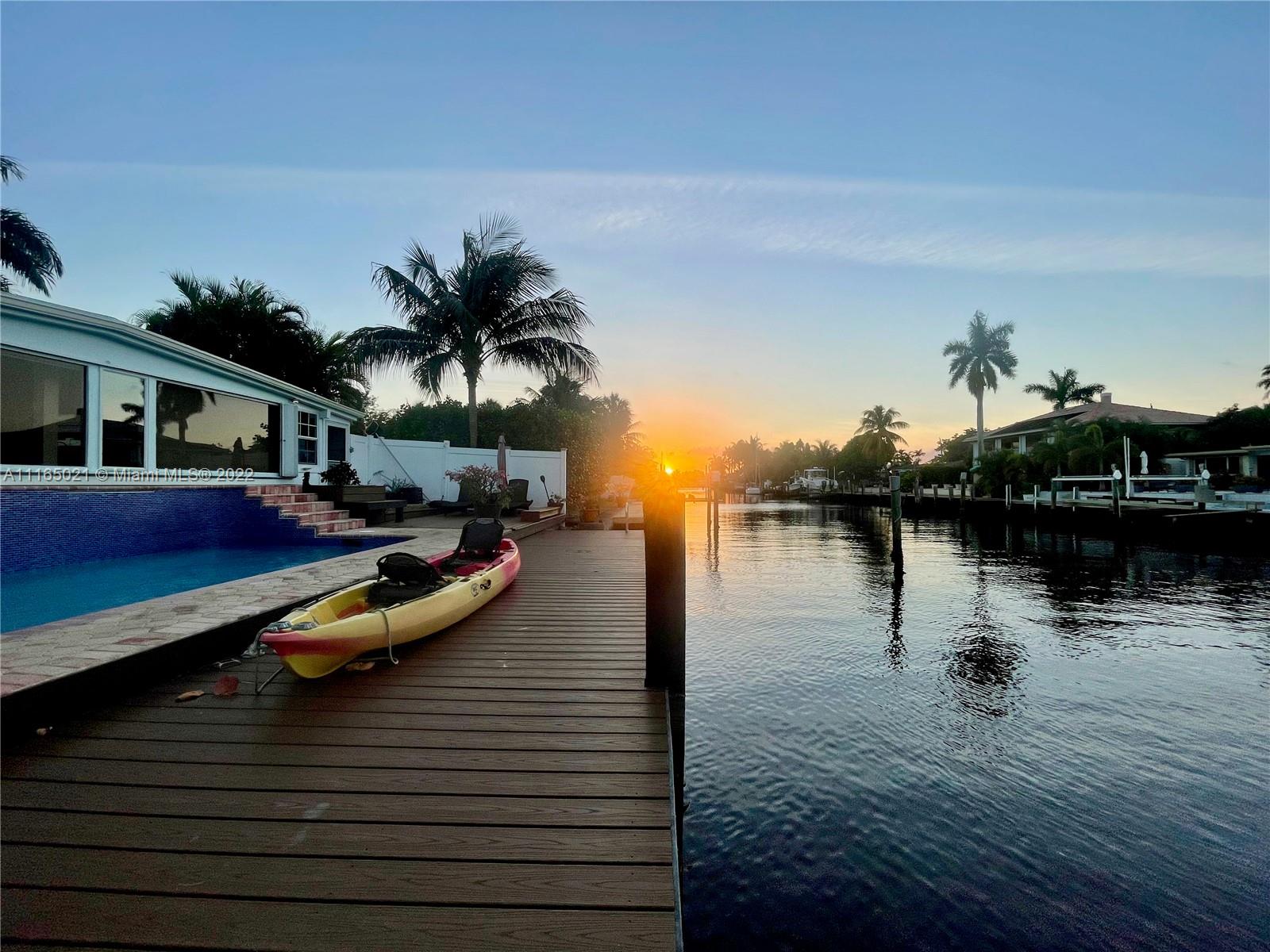 3 Sunset Lane Lauderdale-by-the-Sea, FL 33062 - Photo 4 of 36 a view of a lake with boats and palm trees