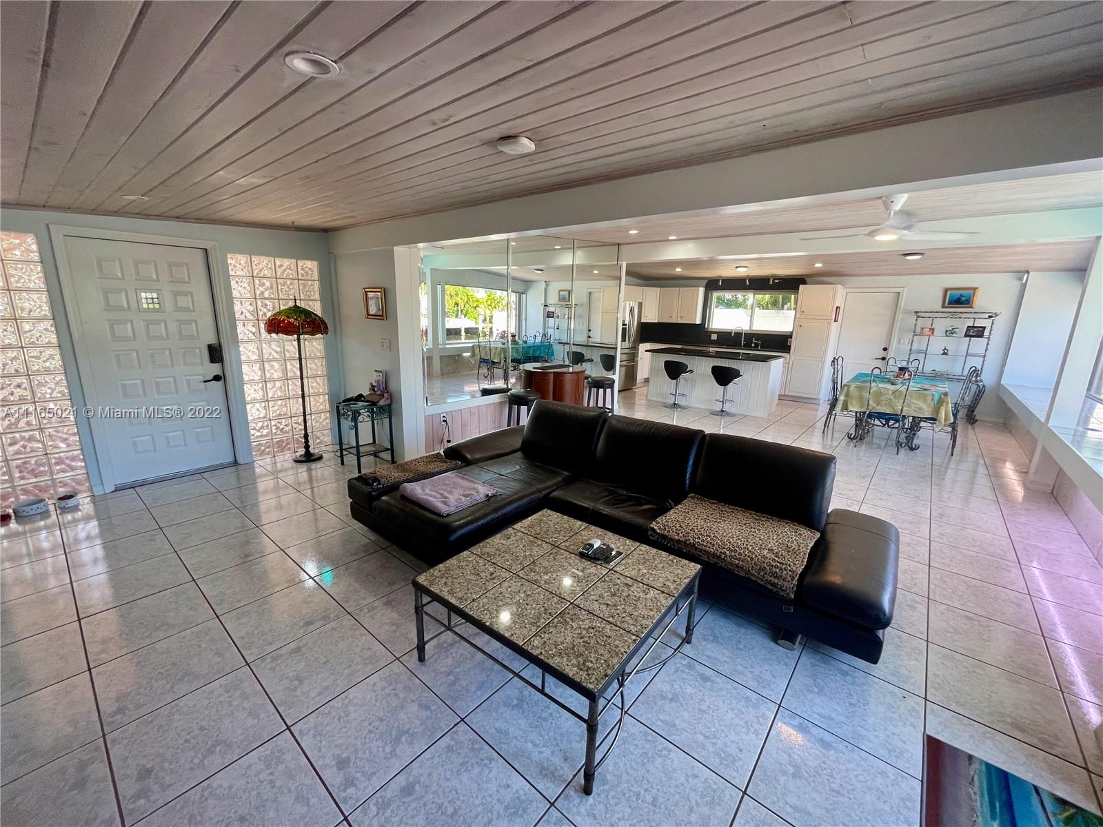 3 Sunset Lane Lauderdale-by-the-Sea, FL 33062 - Photo 9 of 36 a living room with furniture and wooden floor