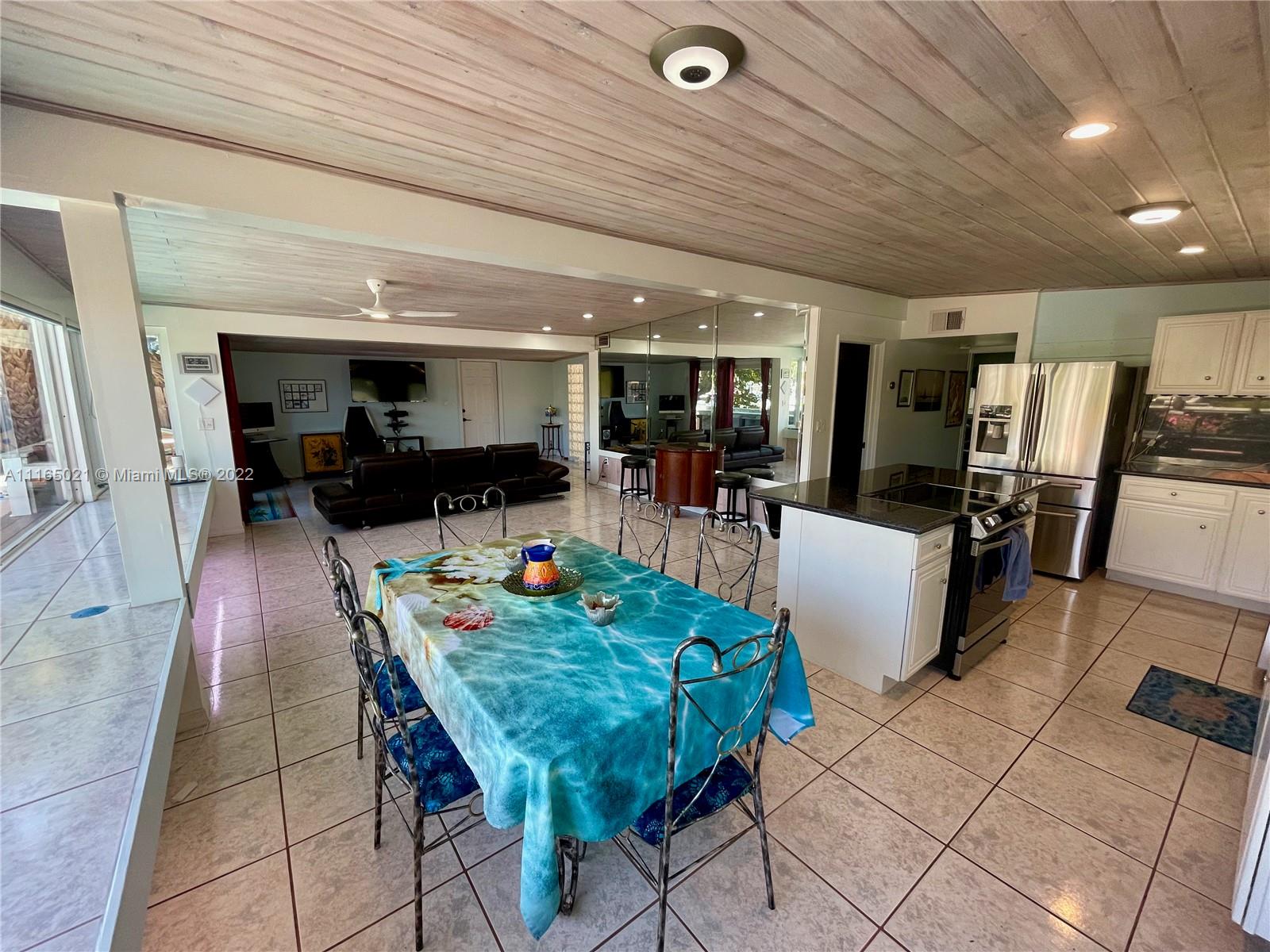 3 Sunset Lane Lauderdale-by-the-Sea, FL 33062 - Photo 10 of 36 a view of a dining room with furniture