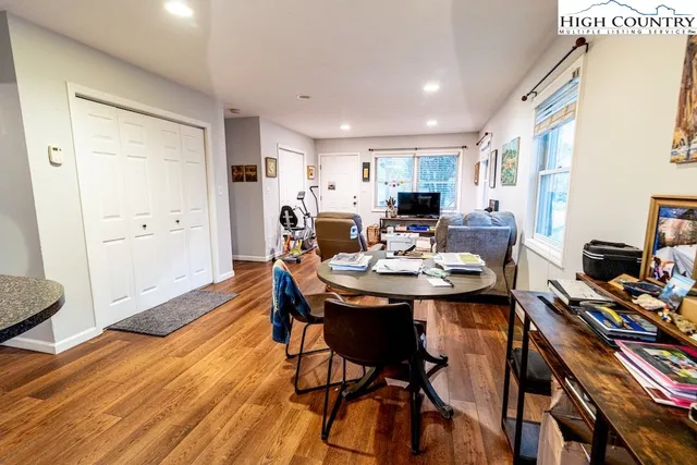 a view of a dining room with furniture and wooden floor