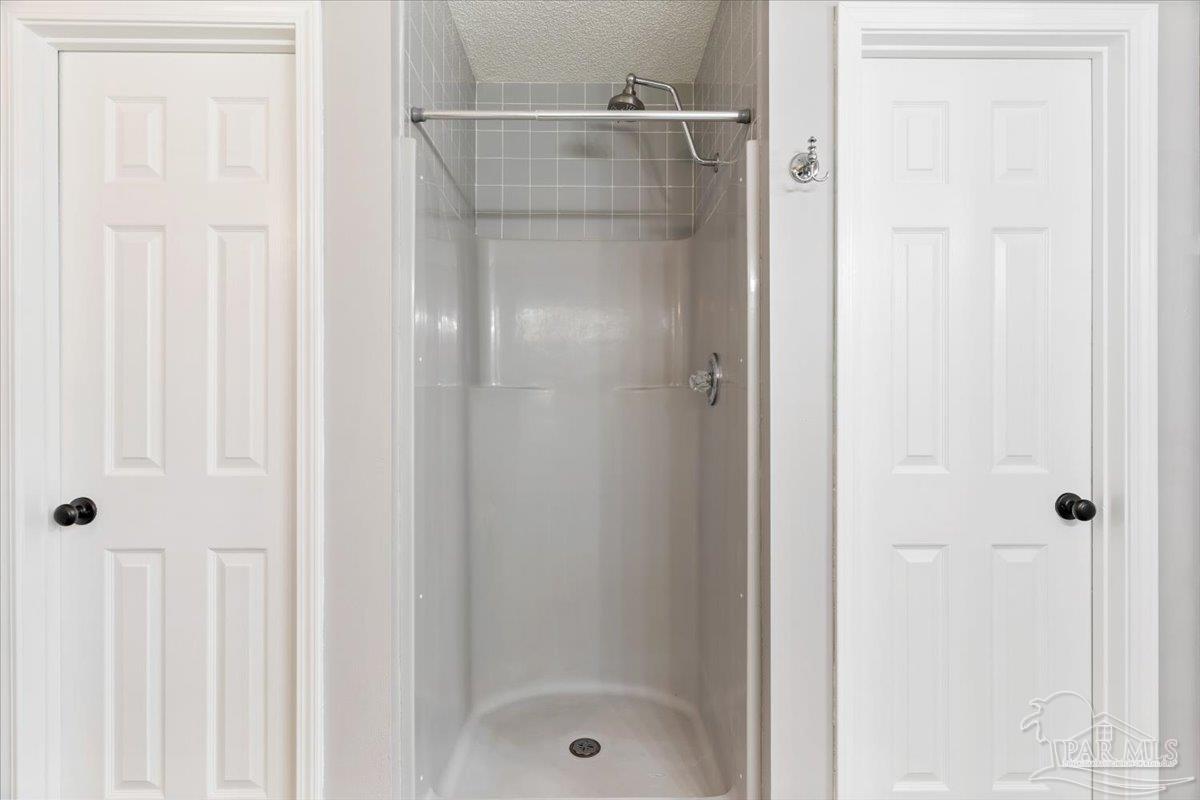 2787 Willow Bend Court Crestview, FL 32539 - Photo 26 of 46 a bathroom with a glass shower door