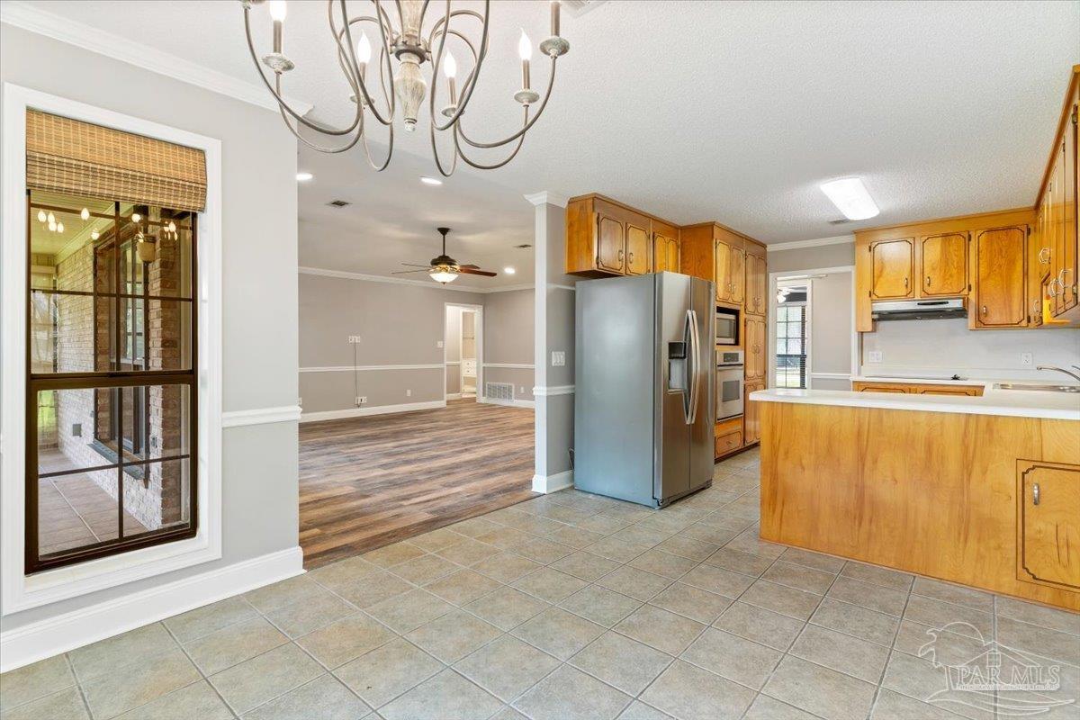 2787 Willow Bend Court Crestview, FL 32539 - Photo 38 of 46 a view of a kitchen with furniture and a kitchen