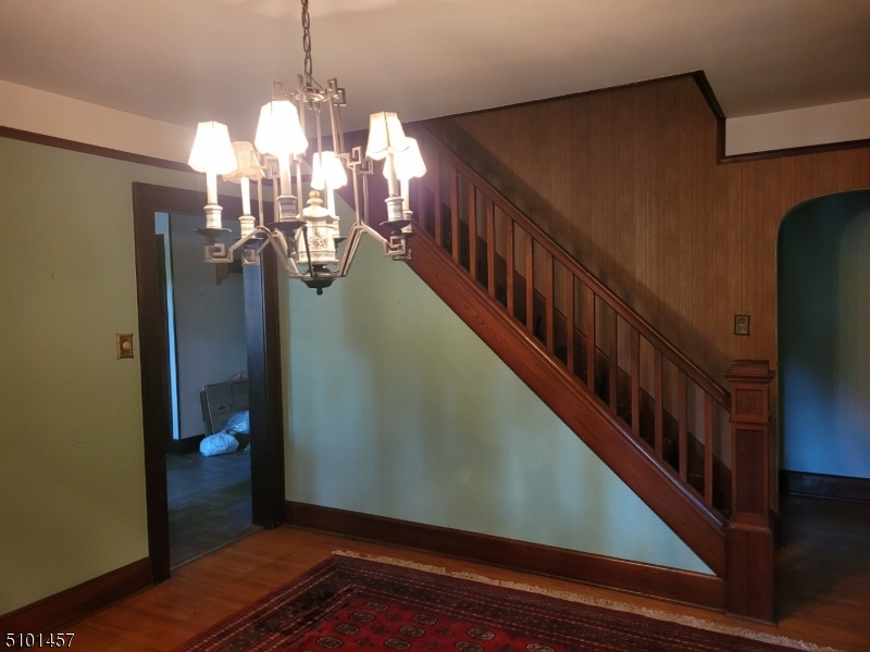 57 Voorhees Corner Road Flemington, NJ 08822 - Photo 4 of 11 a view of a hallway with wooden floor and staircase