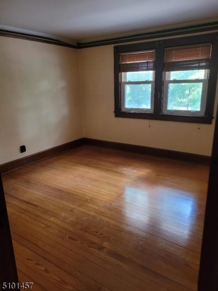 57 Voorhees Corner Road Flemington, NJ 08822 - Photo 10 of 11 an empty room with wooden floor and windows