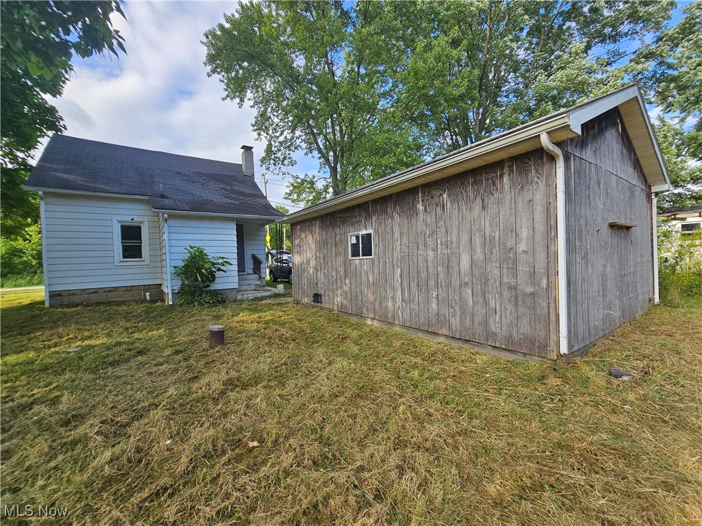 2708 Highway 6 Rome, OH 44085 - Photo 19 of 27 Back of house with an outdoor structure and a yard