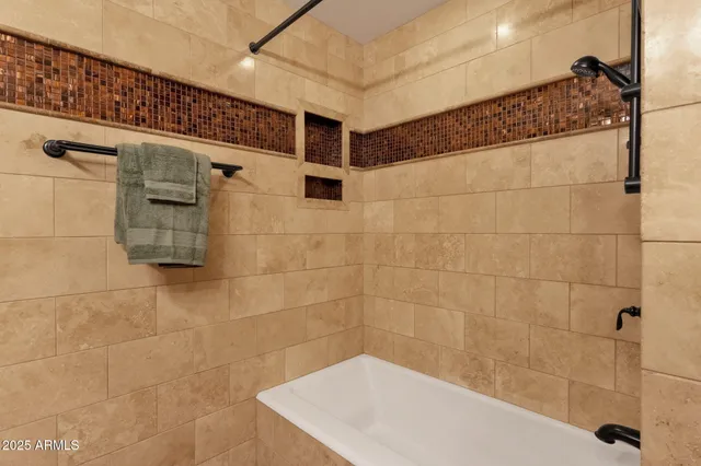 an empty room with a window and a ceiling fan