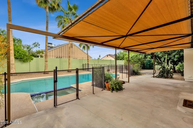 a view of a swimming pool with a patio