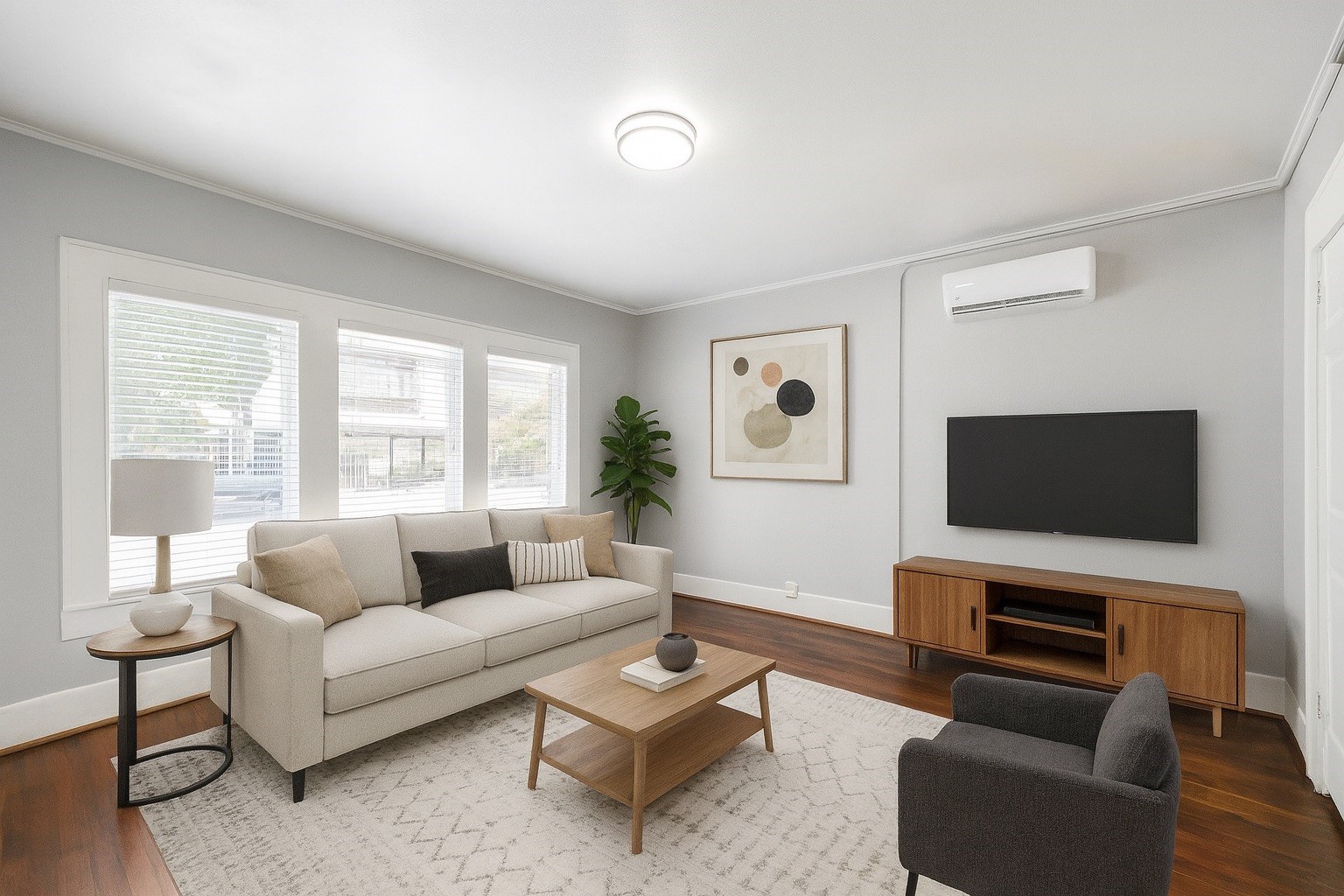 a living room with furniture and a flat screen tv