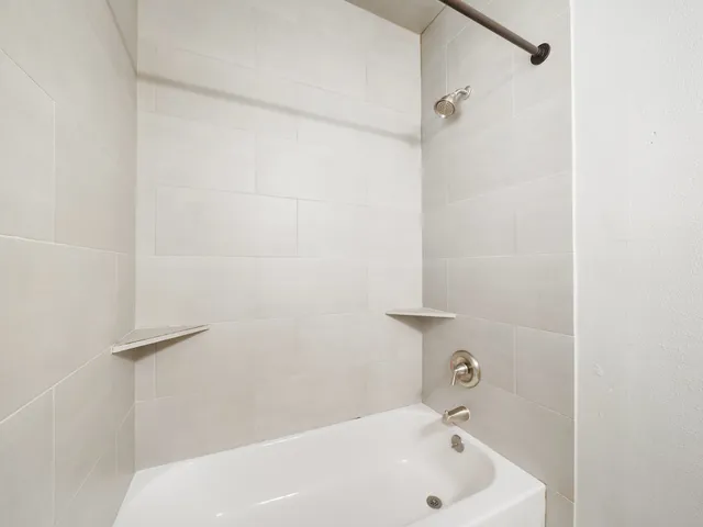 a bathroom with a white bath tub
