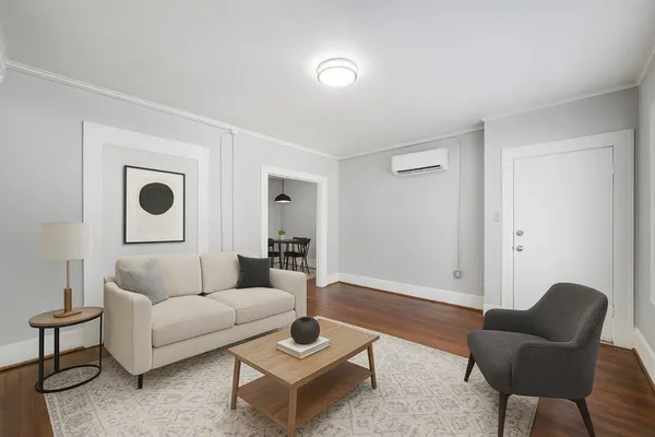 a living room with furniture and a rug