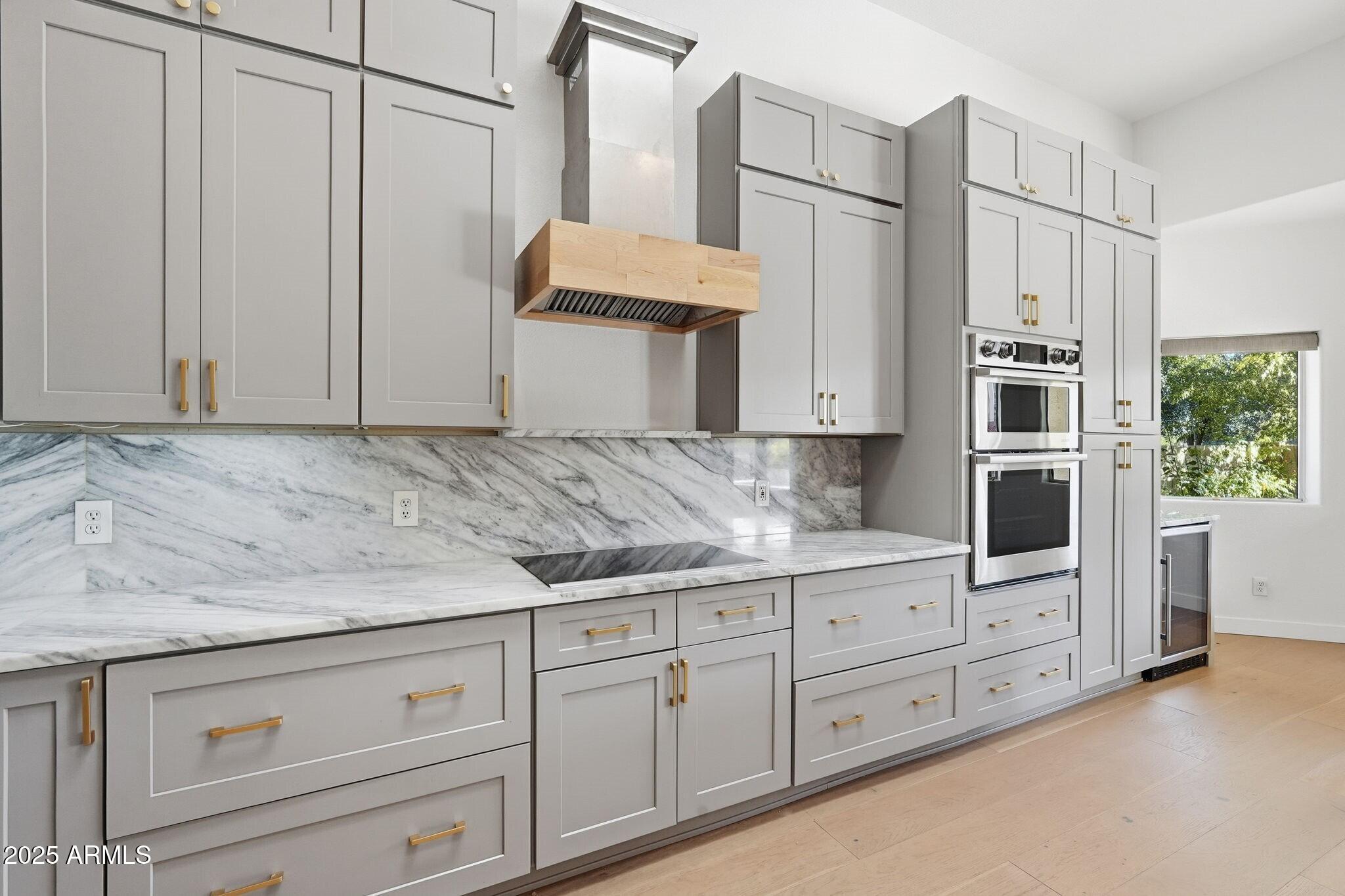 11415 North 44th Street Phoenix, AZ 85028 - Photo 15 of 56 a kitchen with stainless steel appliances granite countertop a refrigerator and cabinets