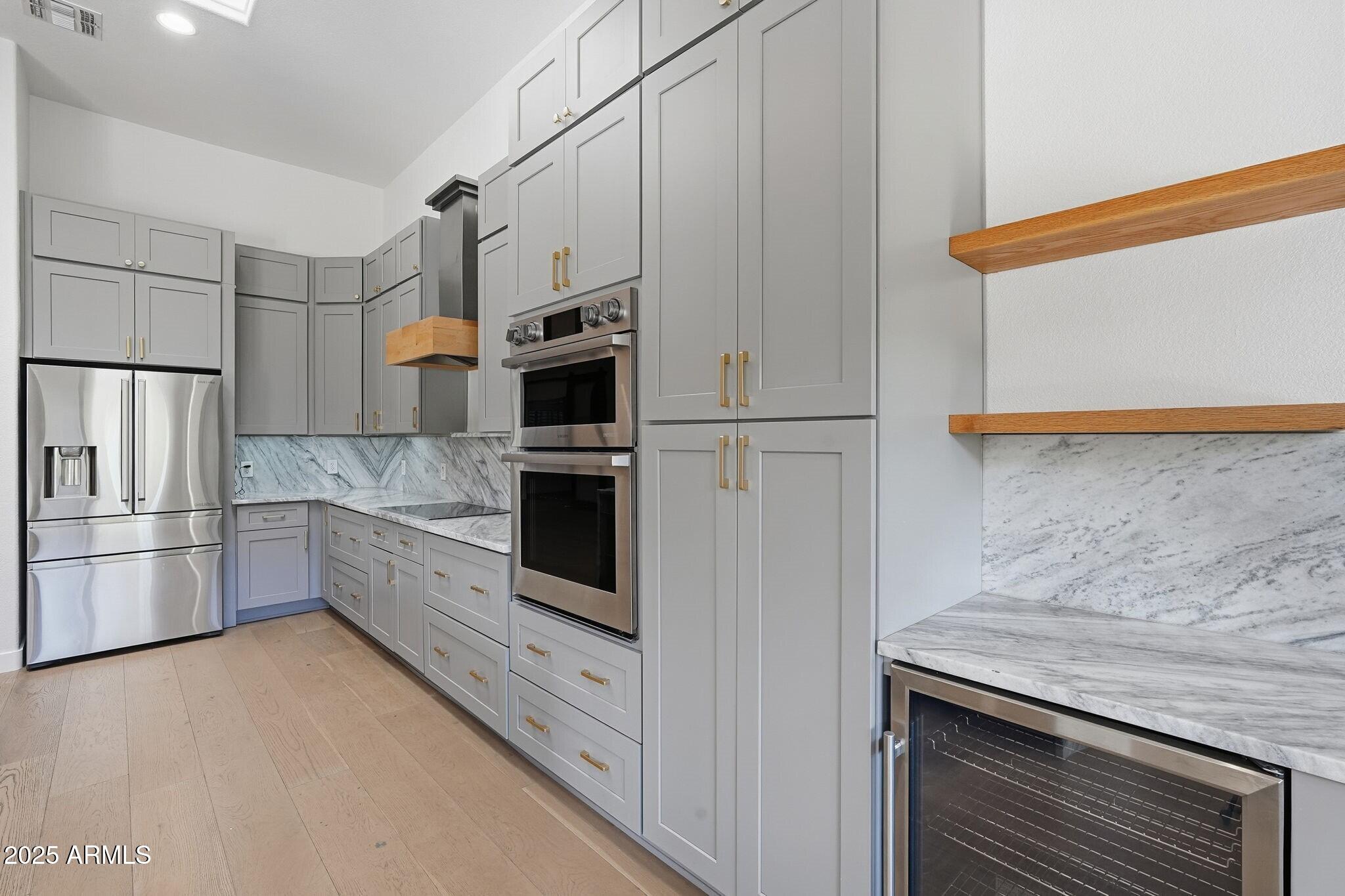 11415 North 44th Street Phoenix, AZ 85028 - Photo 19 of 56 a kitchen with stainless steel appliances a refrigerator sink and microwave
