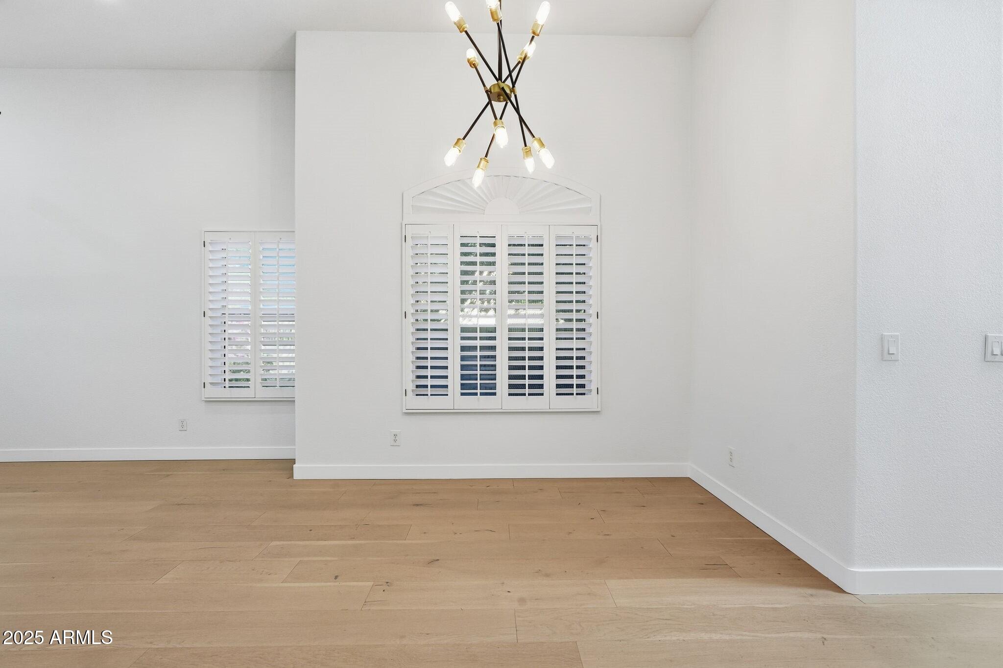 11415 North 44th Street Phoenix, AZ 85028 - Photo 23 of 56 a view of an empty room with a window