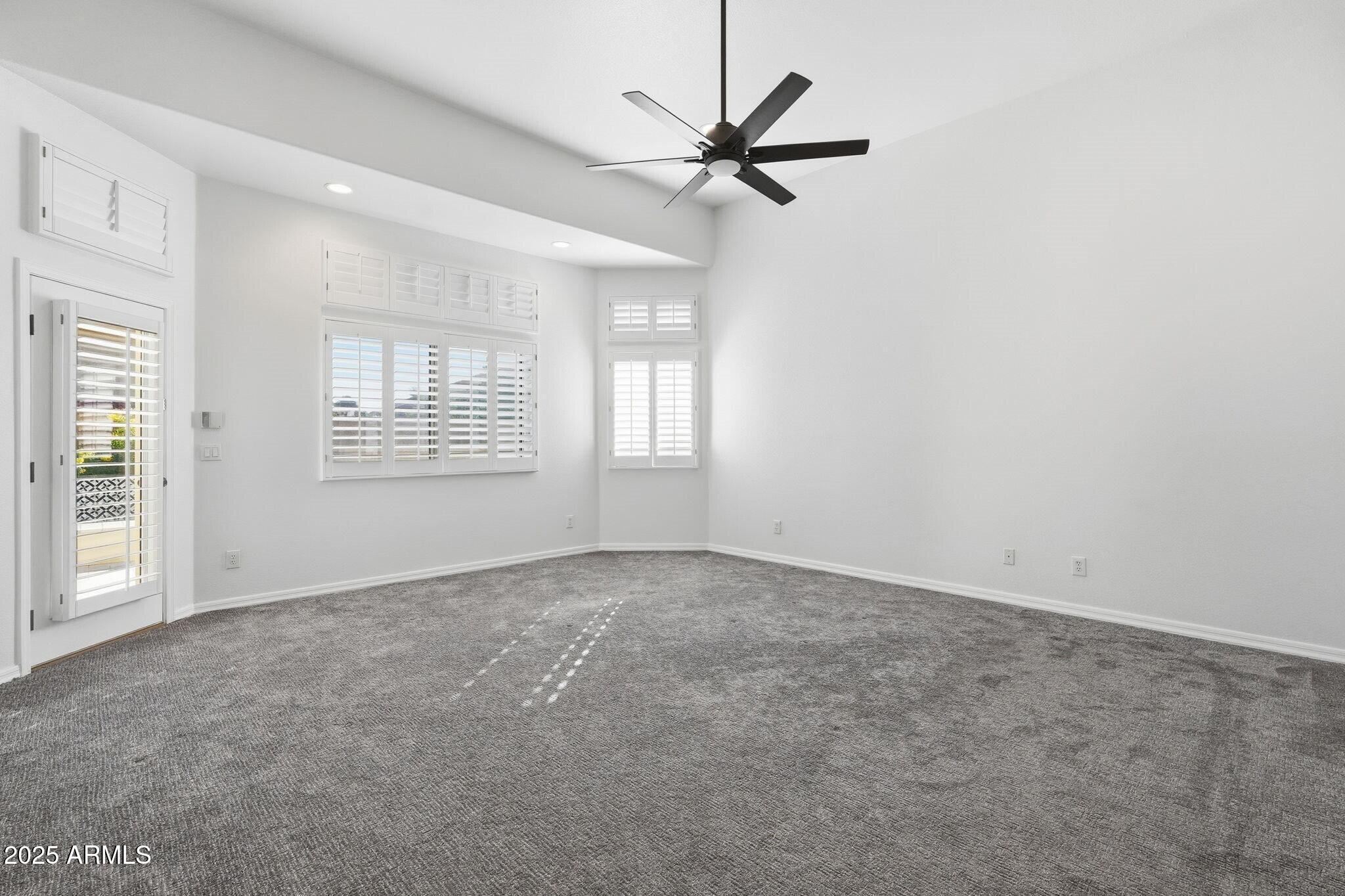 11415 North 44th Street Phoenix, AZ 85028 - Photo 29 of 56 an empty room with windows and fan
