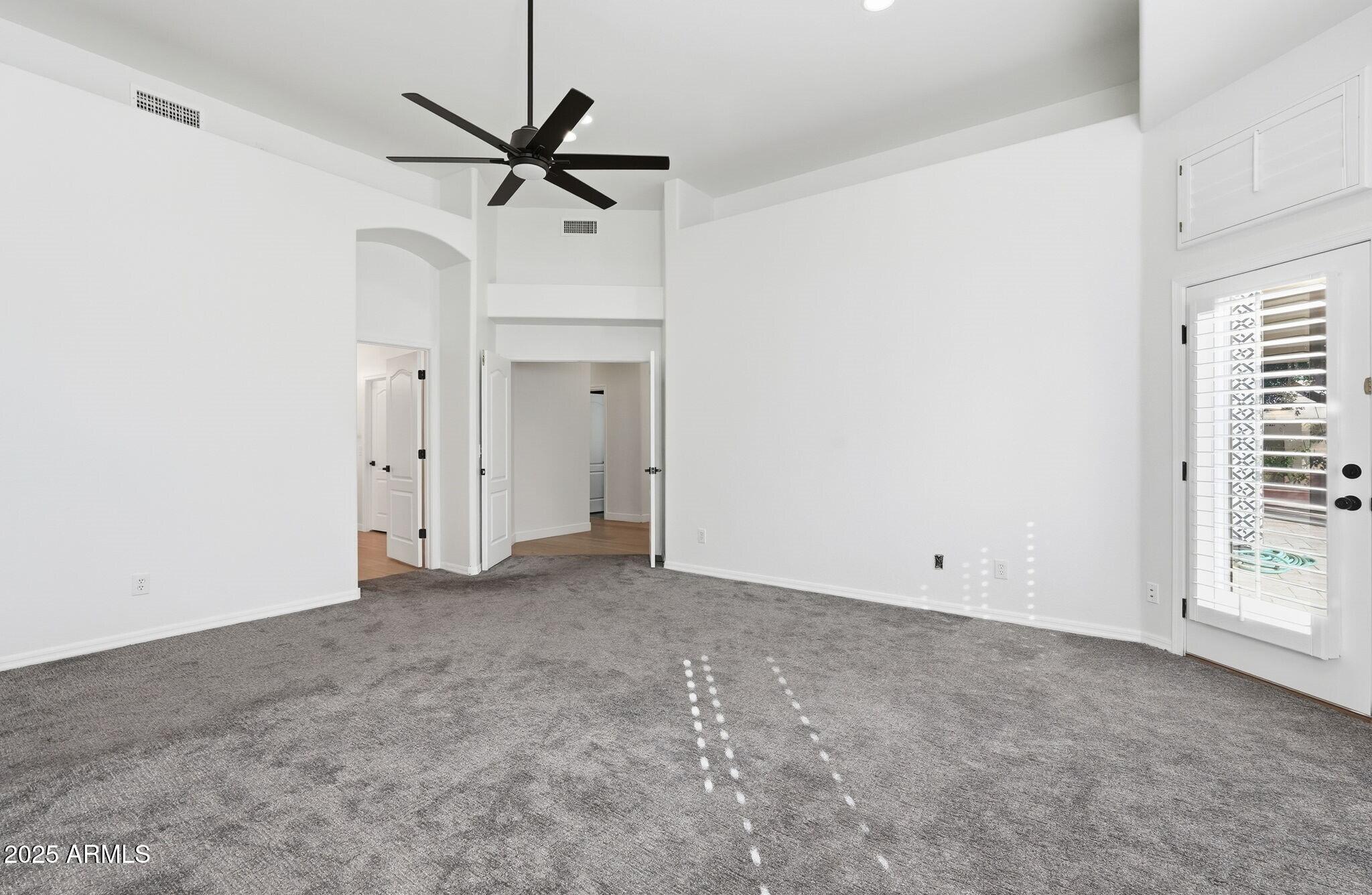 11415 North 44th Street Phoenix, AZ 85028 - Photo 31 of 56 a view of an empty room with a ceiling fan