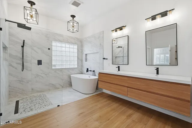a bathroom with a bathtub and a shower
