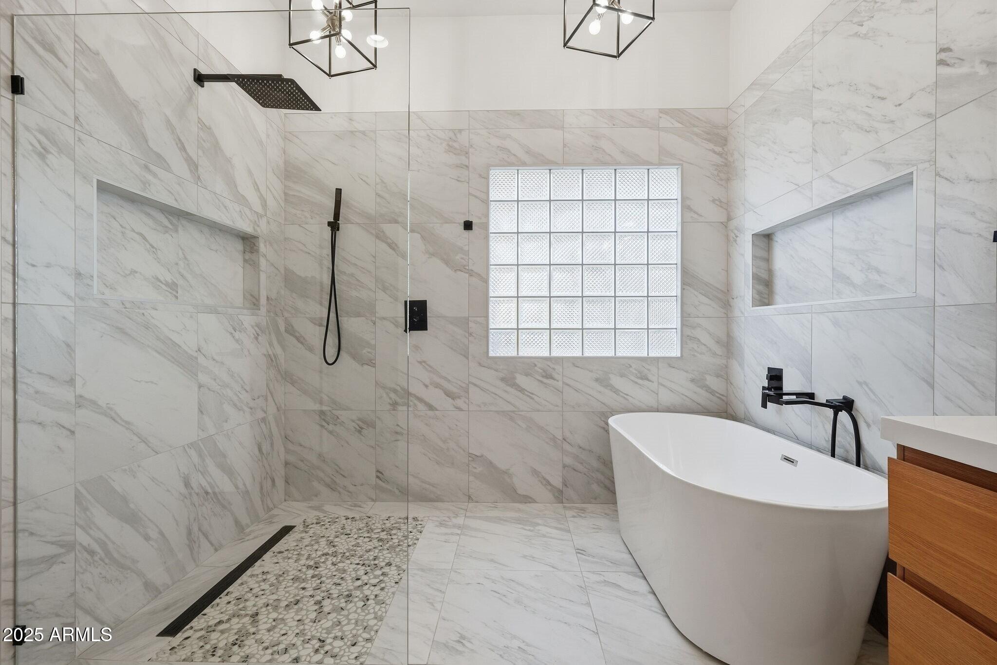 11415 North 44th Street Phoenix, AZ 85028 - Photo 34 of 56 a bathroom with a bathtub and shower