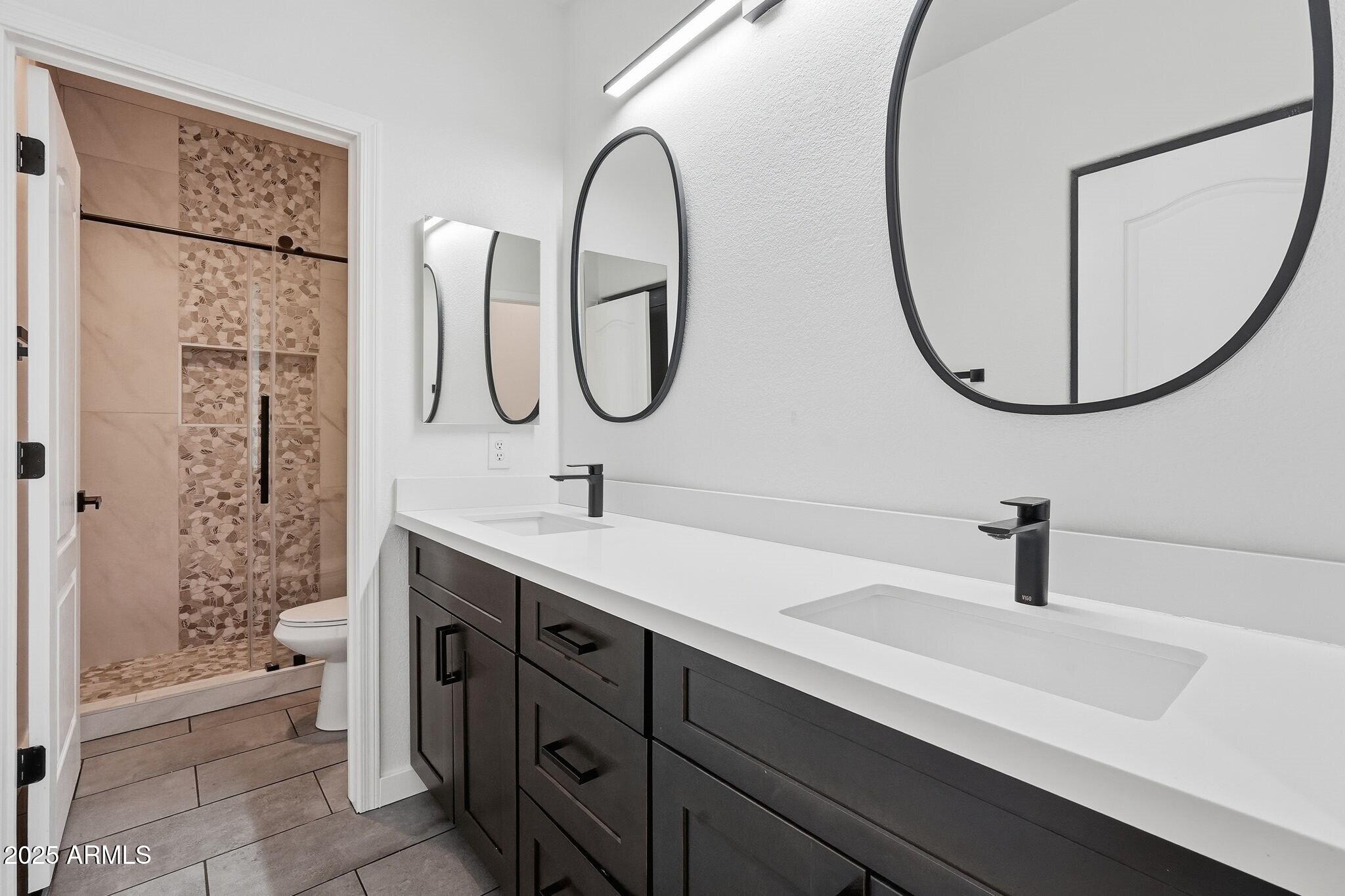11415 North 44th Street Phoenix, AZ 85028 - Photo 38 of 56 a bathroom with a sink and a mirror