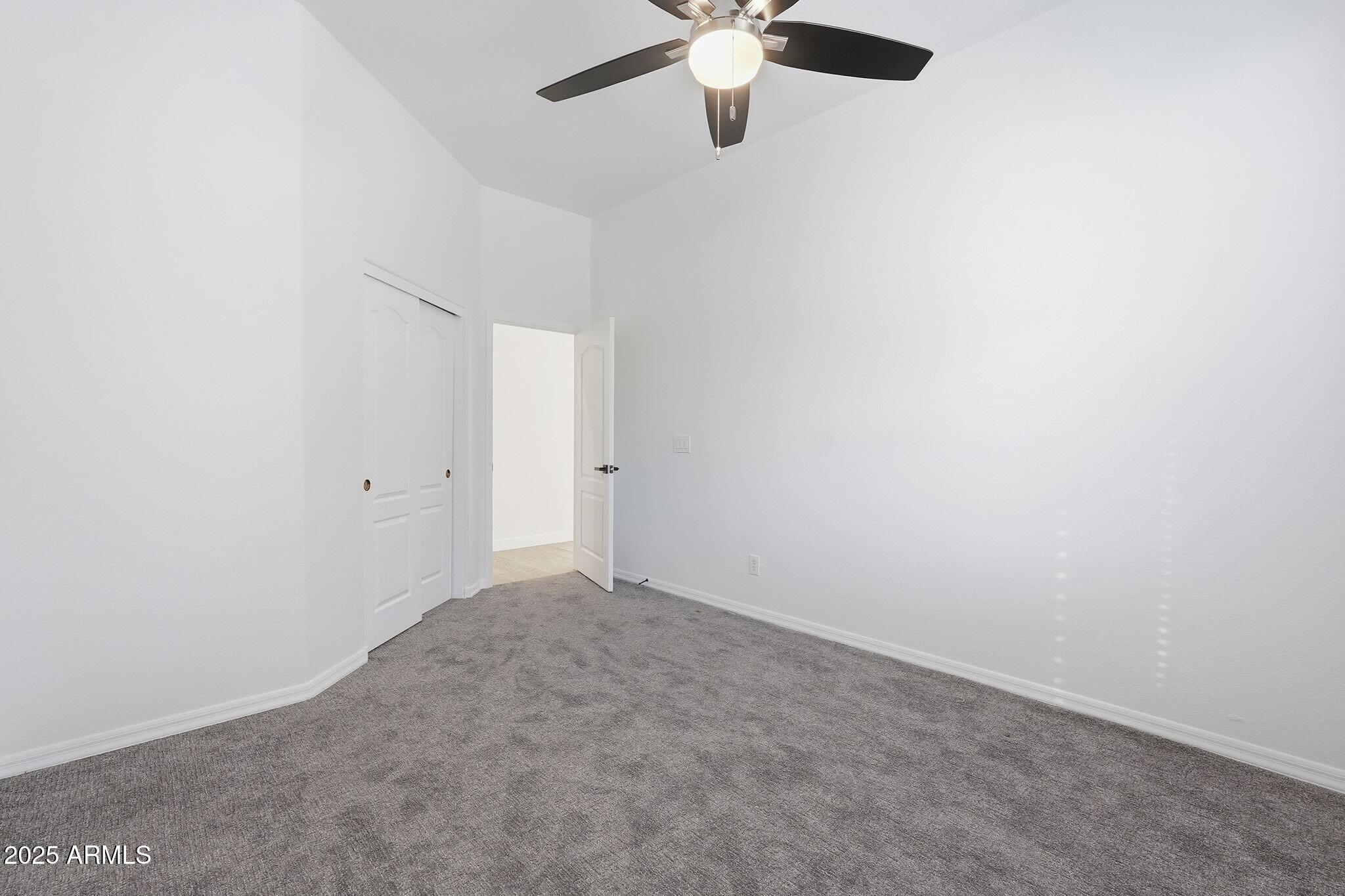 11415 North 44th Street Phoenix, AZ 85028 - Photo 41 of 56 an empty room with a window and a fan