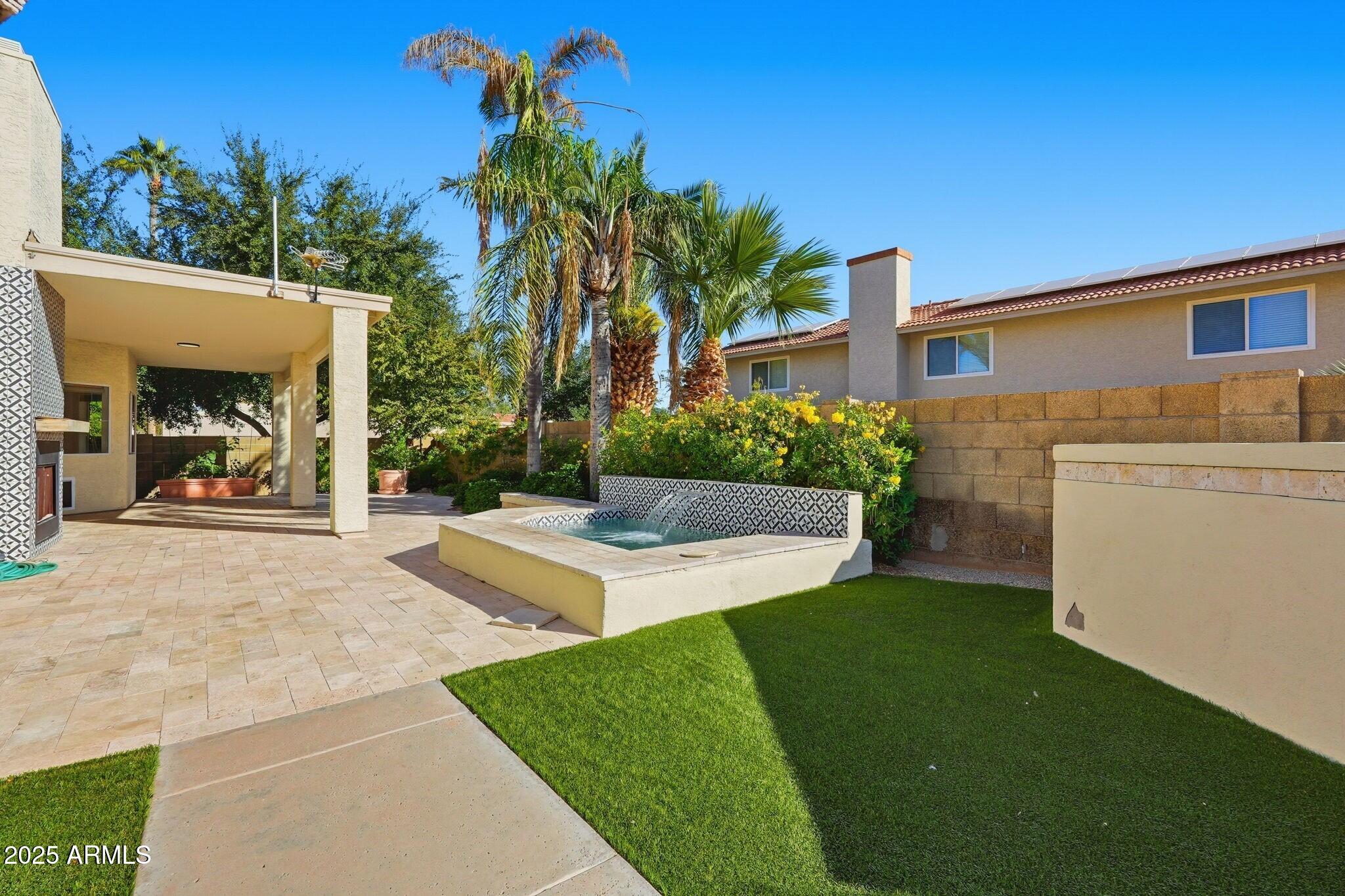 11415 North 44th Street Phoenix, AZ 85028 - Photo 52 of 56 a view of a house with backyard and a tree