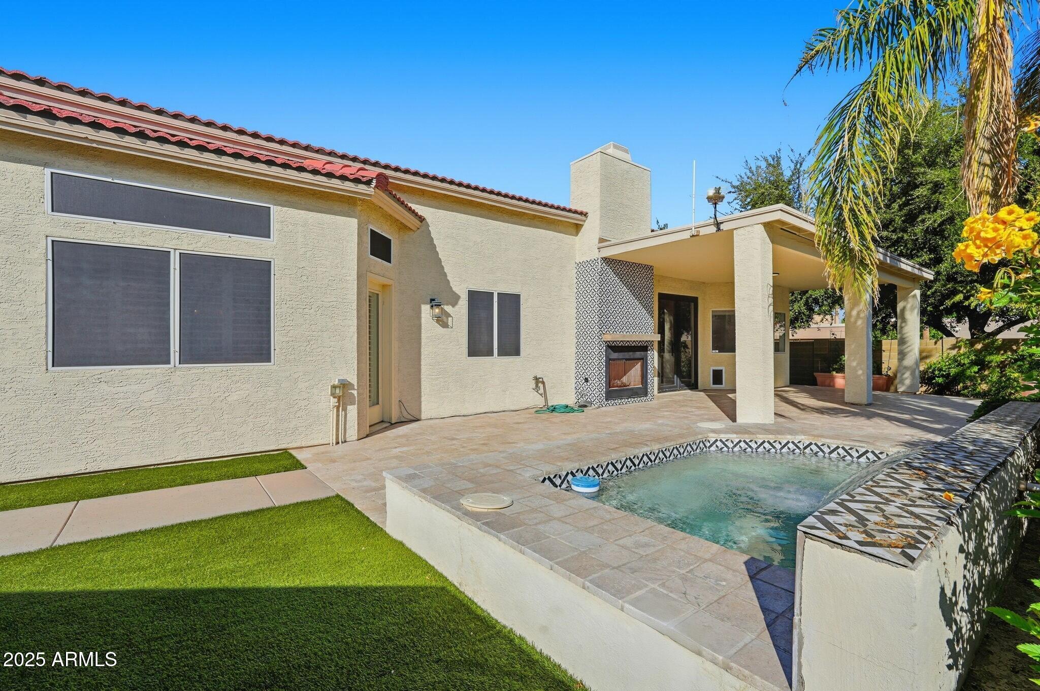 11415 North 44th Street Phoenix, AZ 85028 - Photo 54 of 56 a front view of a house with a yard