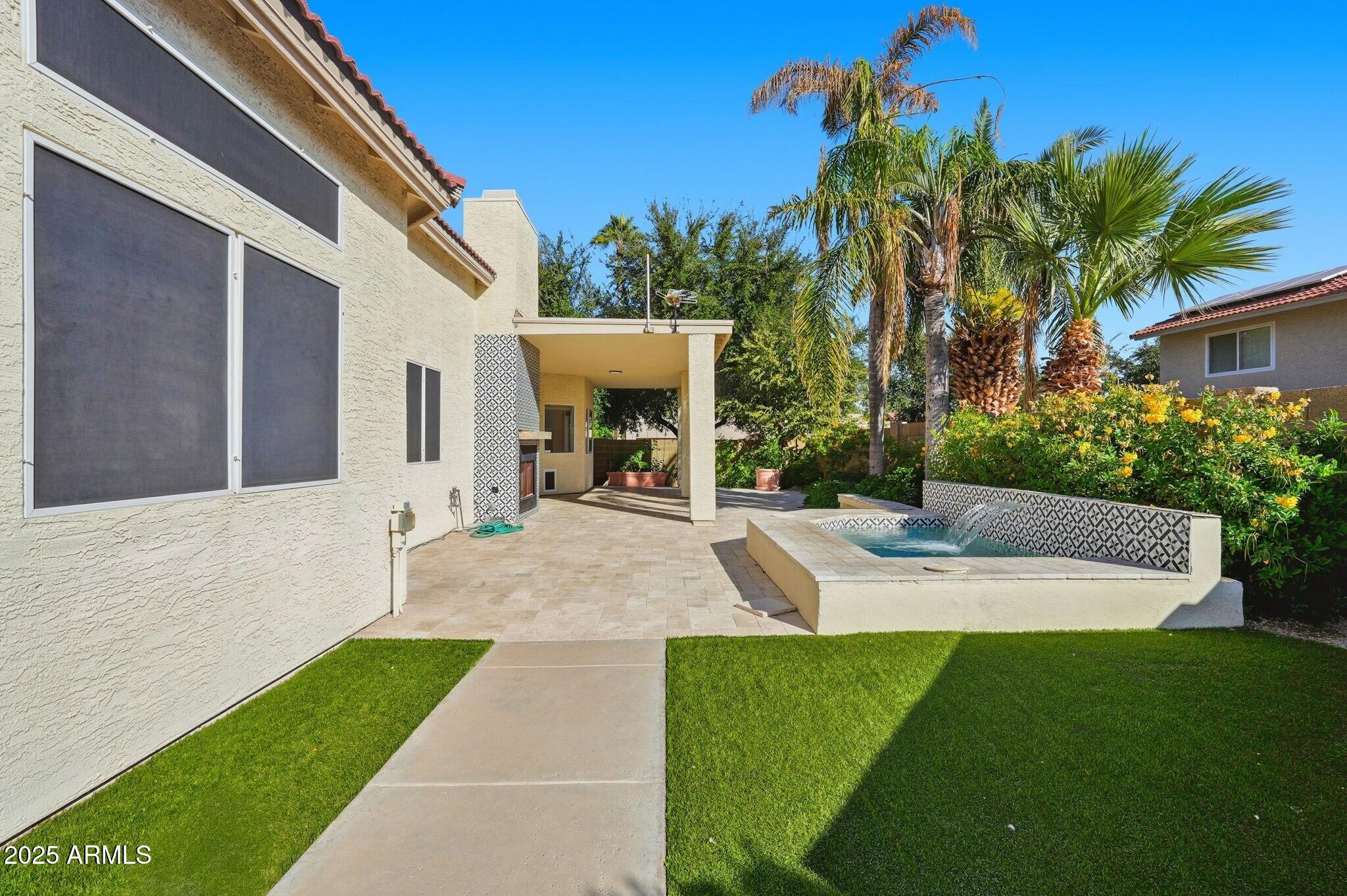 11415 North 44th Street Phoenix, AZ 85028 - Photo 55 of 56 a view of a backyard with a garden and plants