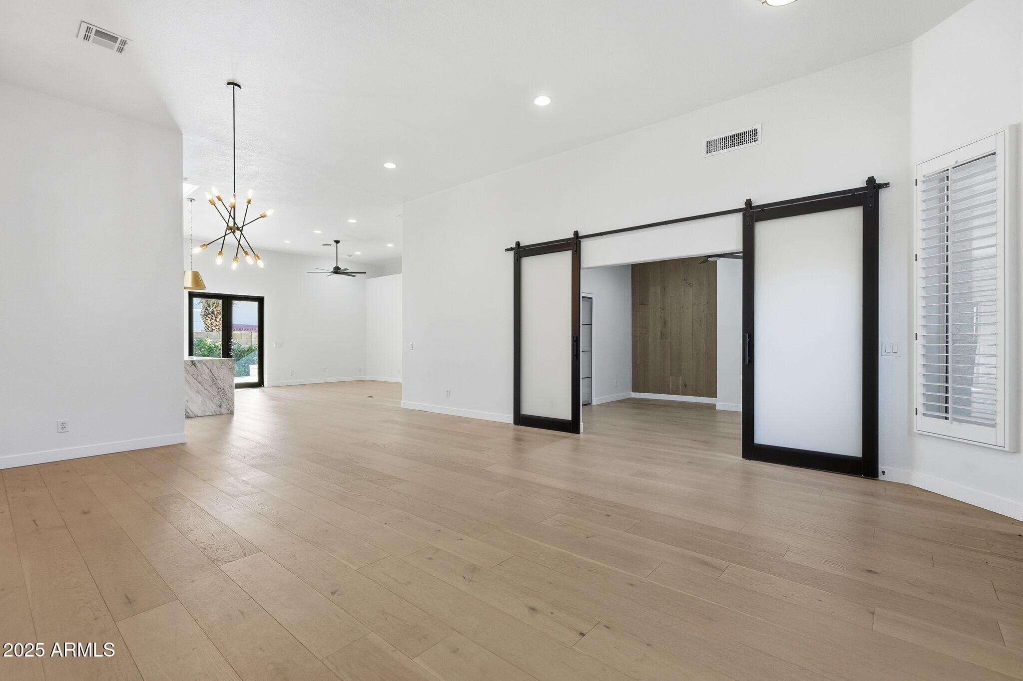 11415 North 44th Street Phoenix, AZ 85028 - Photo 9 of 56 a view of a room with a stylish ceiling fan and entryway